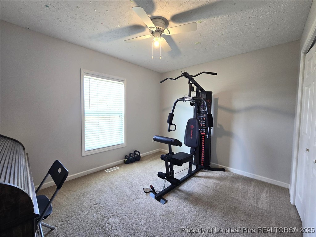 5345 Pittman Grove Church Road Raeford, NC 28376 - Photo 34 of 45 a view of a workspace with furniture and a window