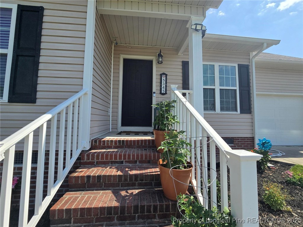 5345 Pittman Grove Church Road Raeford, NC 28376 - Photo 5 of 45 a view of a wooden deck front of house