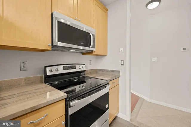 a kitchen with a stove and a microwave