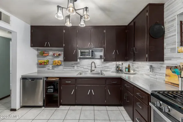 a kitchen with a sink and cabinets