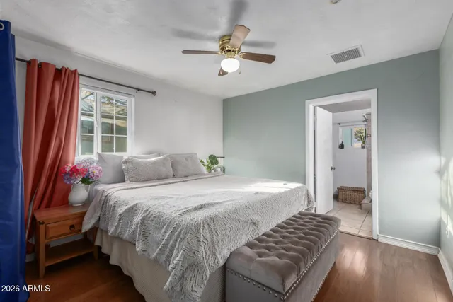 a bedroom with a bed and window