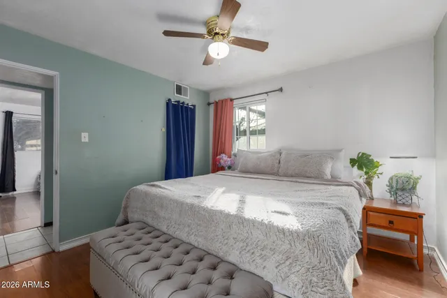 a bedroom with a bed and a couch