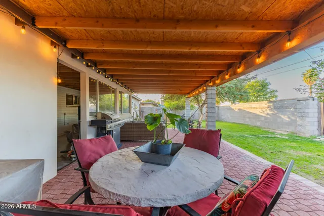 a outdoor dining space with furniture and potted plants