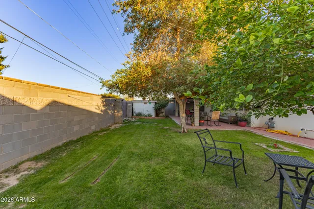 a view of a pathway of a house with a yard