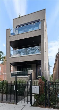 a living room with fireplace furniture and a chandelier