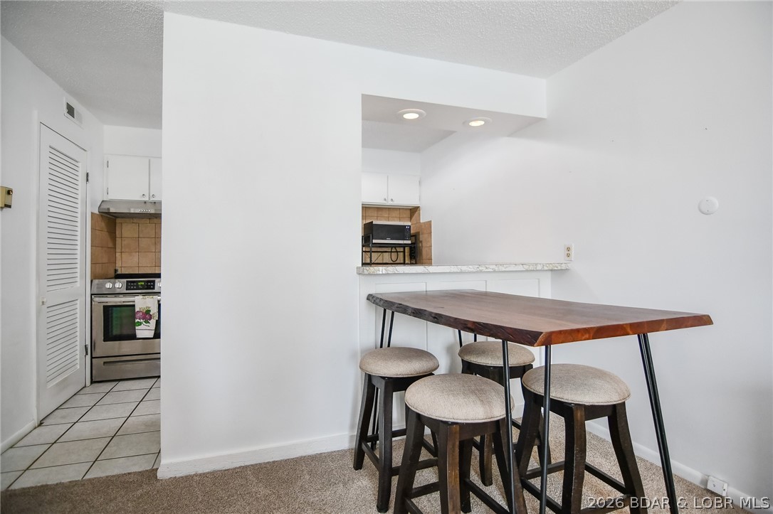 1118 Passover Road, Unit E216 Osage Beach, MO 65065 - Photo 6 of 31 Dining area/kitchen