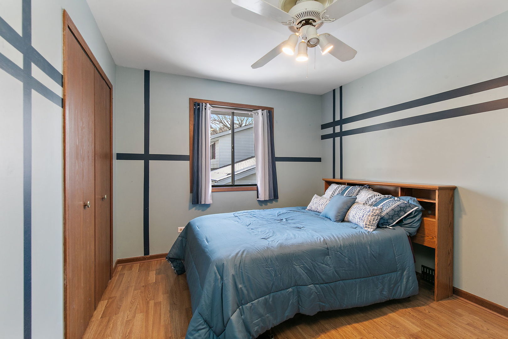 183 Brookside Drive Elgin, IL 60123 - Photo 18 of 46 a bedroom with a bed and window