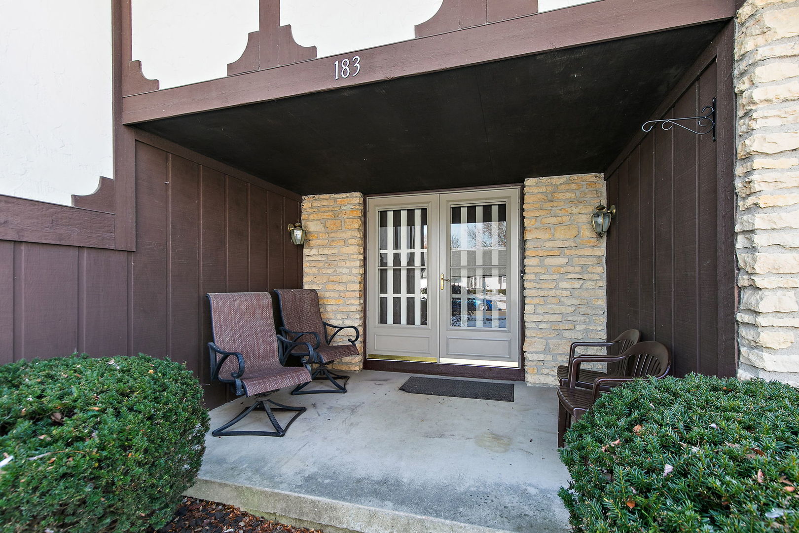 183 Brookside Drive Elgin, IL 60123 - Photo 3 of 46 a backyard of a house with a couch swing chair and grass