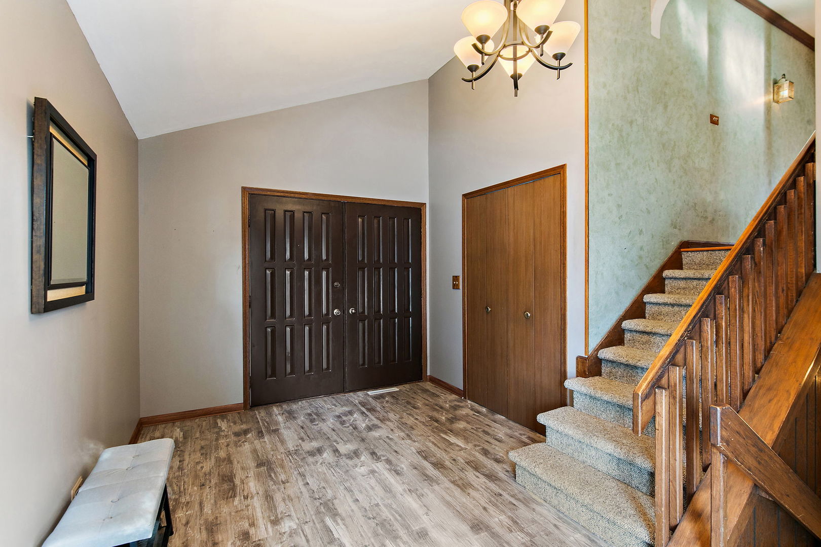 183 Brookside Drive Elgin, IL 60123 - Photo 4 of 46 a view of a hallway with wooden floor and staircase