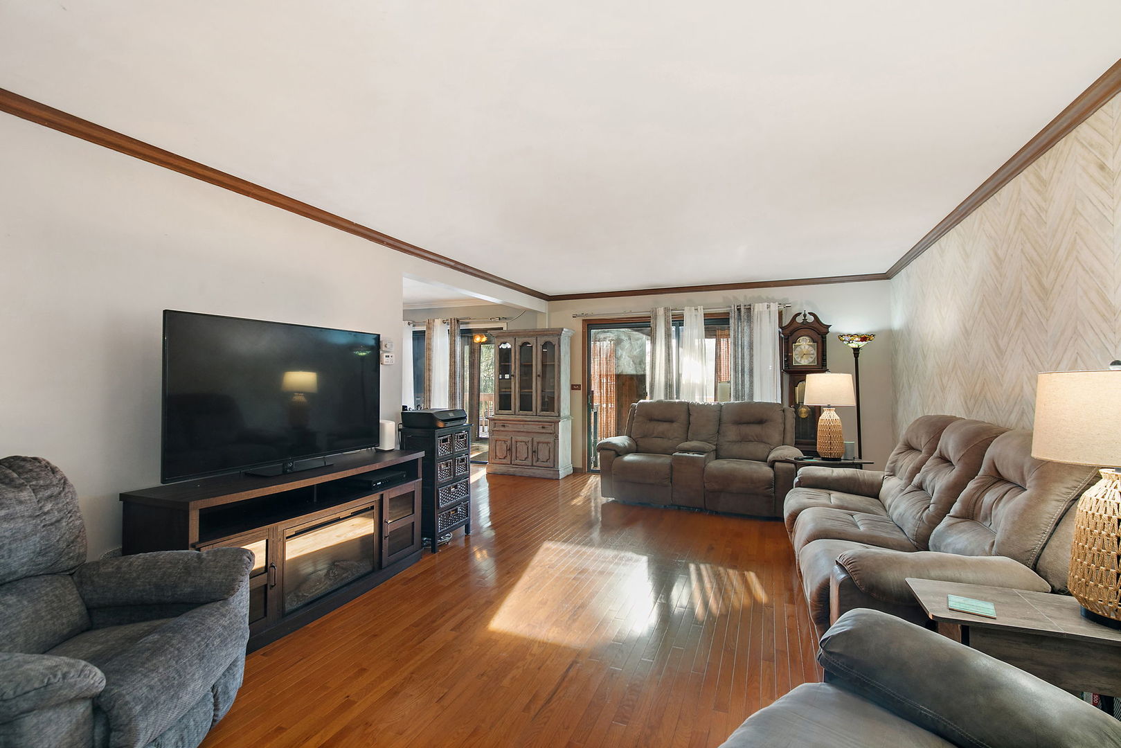 183 Brookside Drive Elgin, IL 60123 - Photo 6 of 46 a living room with furniture and a flat screen tv