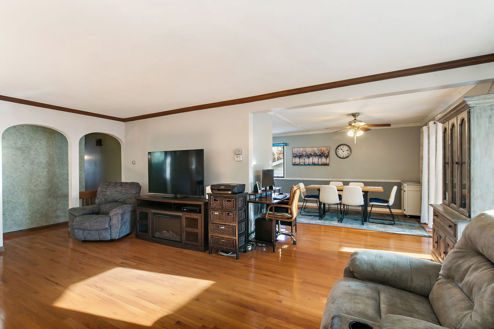 183 Brookside Drive Elgin, IL 60123 - Photo 7 of 46 a living room with furniture and a flat screen tv