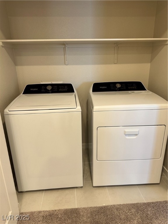 Undisclosed Address Henderson, NV 89011 - Photo 8 of 8 Washroom featuring light tile patterned floors and washing machine and clothes dryer