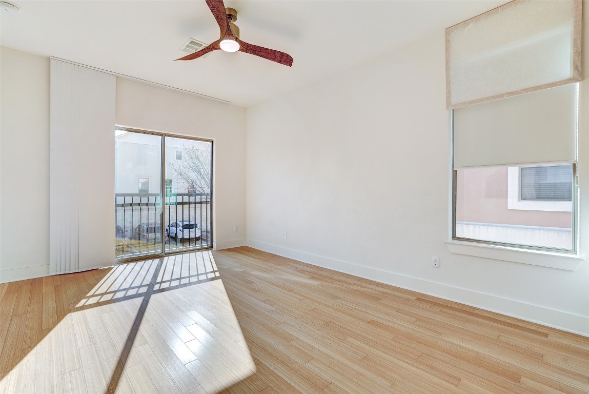 13420 Lyndhurst Street, Unit 208 Austin, TX 78717 - Photo 21 of 40 a view of a room with wooden floor and windows
