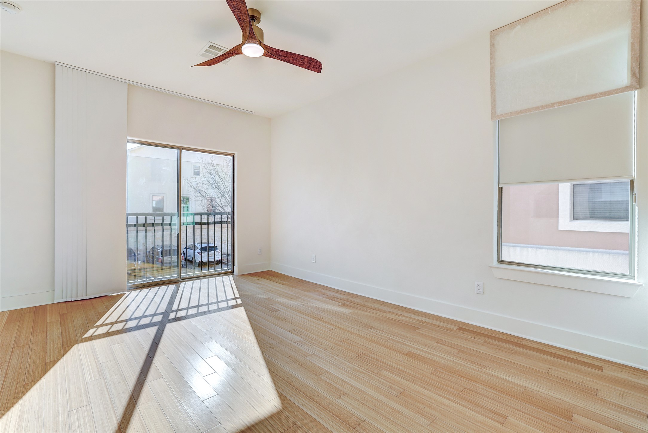 13420 Lyndhurst Street, Unit 208 Austin, TX 78717 - Photo 21 of 40 a view of a room with wooden floor and windows
