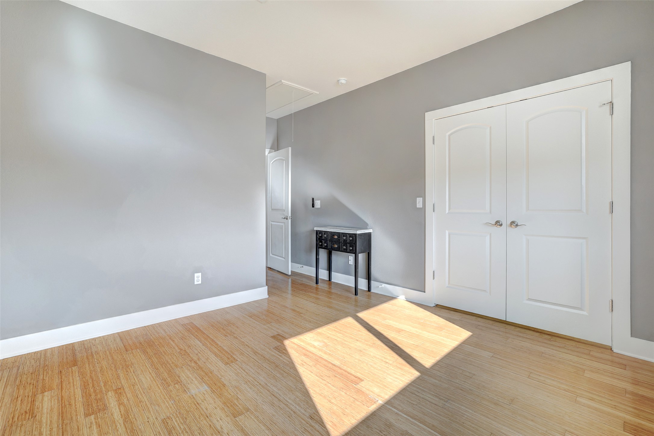 13420 Lyndhurst Street, Unit 208 Austin, TX 78717 - Photo 24 of 40 an empty room with wooden floor and windows