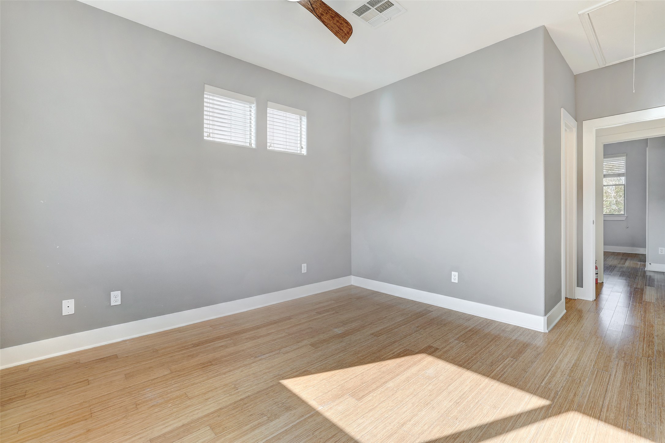 13420 Lyndhurst Street, Unit 208 Austin, TX 78717 - Photo 25 of 40 an empty room with wooden floor and windows
