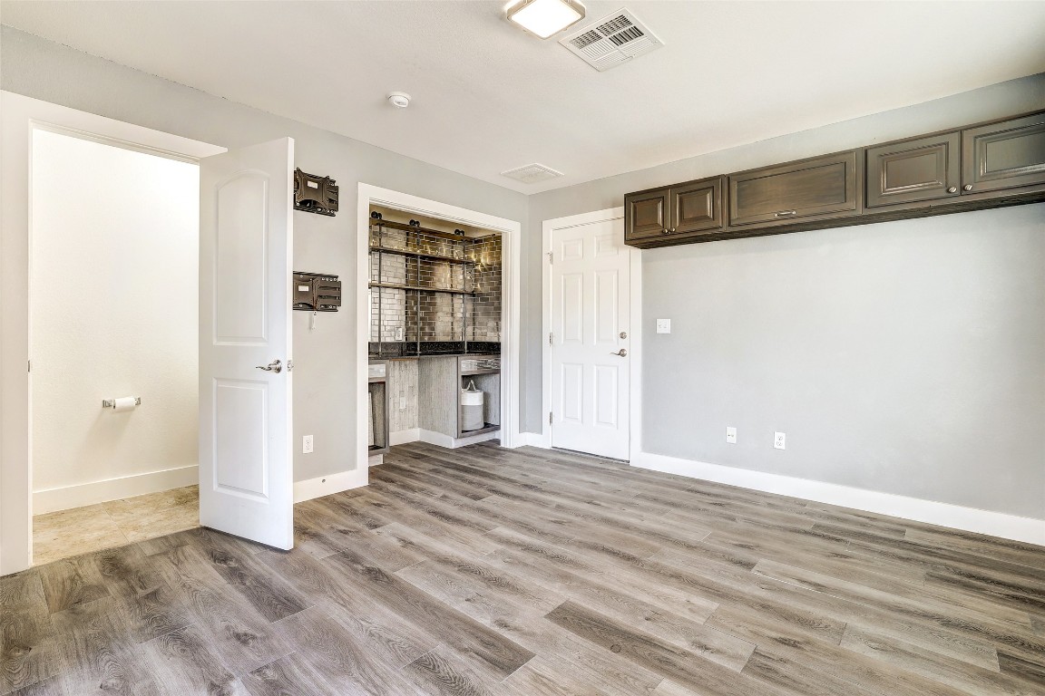 13420 Lyndhurst Street, Unit 208 Austin, TX 78717 - Photo 35 of 40 a view of empty room with wooden floor and window