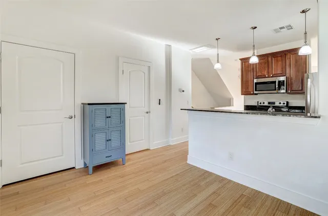 a view of kitchen with wooden floor