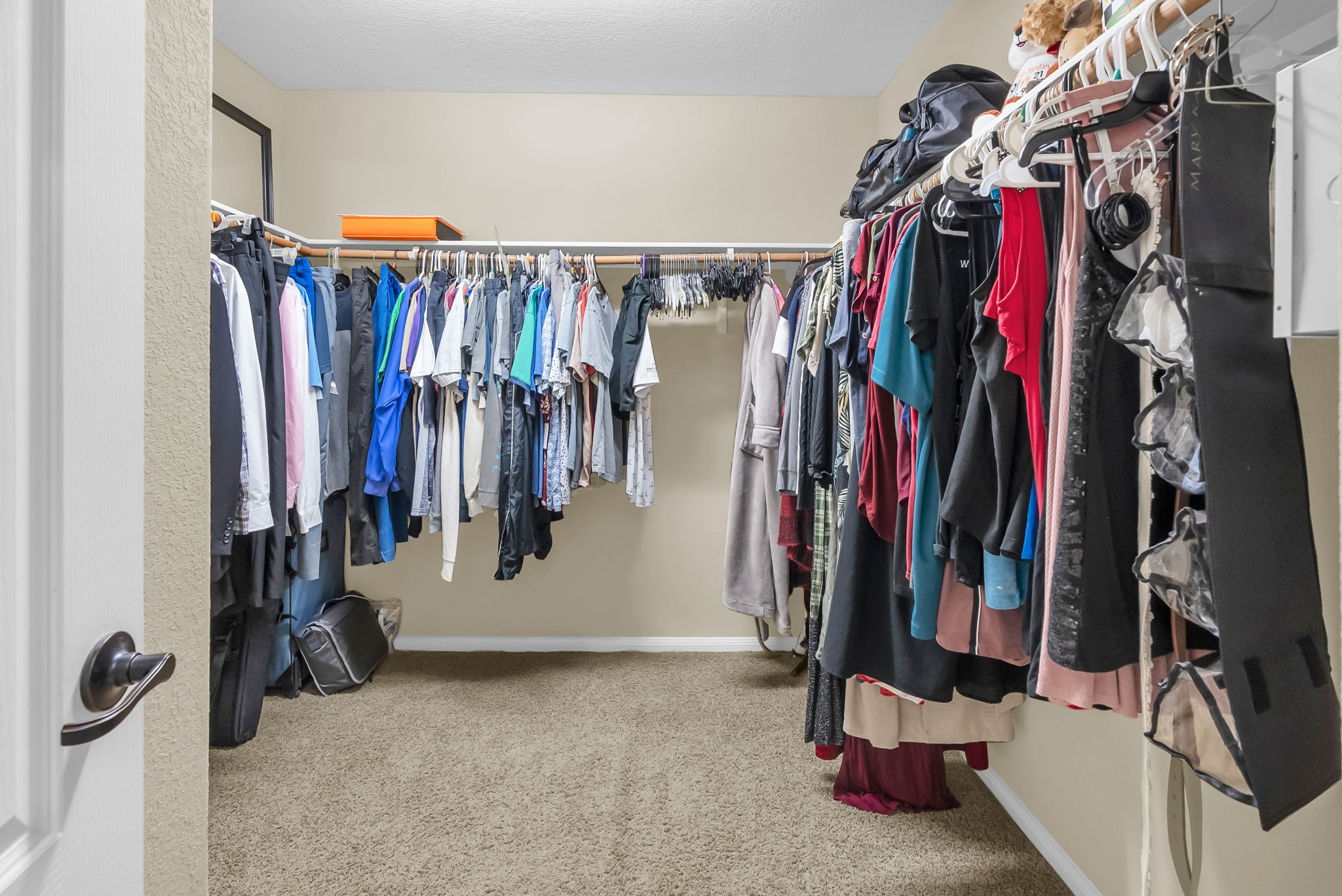 16619 Dover Mills Drive Spring, TX 77379 - Photo 30 of 49 a view of walk in closet with clothes