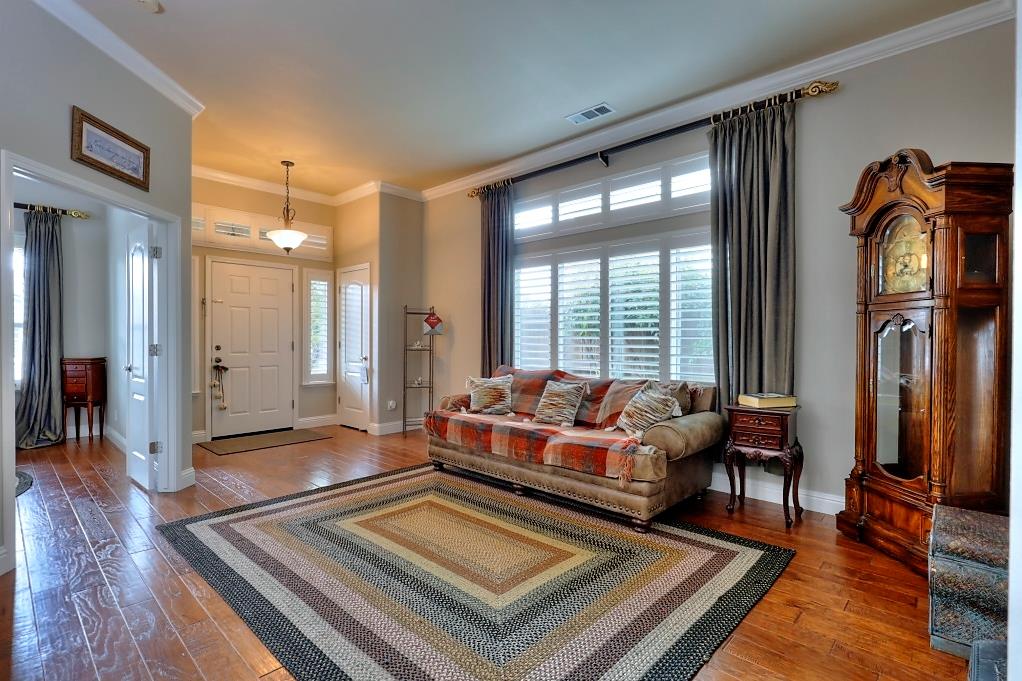 4152 Post Oak Drive Turlock, CA 95382 - Photo 14 of 71 a living room with furniture rug and wooden floor