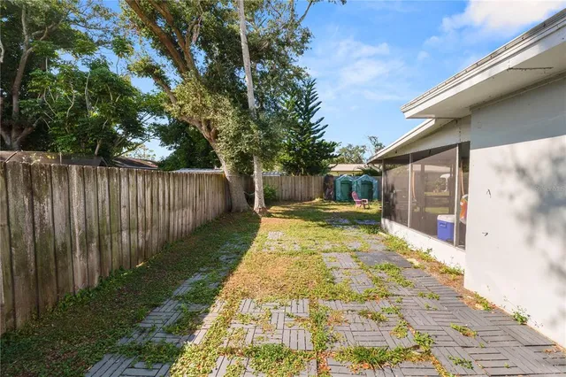 an aerial view of residential houses with city view