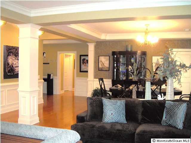 2201 River Road, Unit 3104 Point Pleasant, NJ 08742 - Photo 2 of 3 a living room with furniture and a flat screen tv