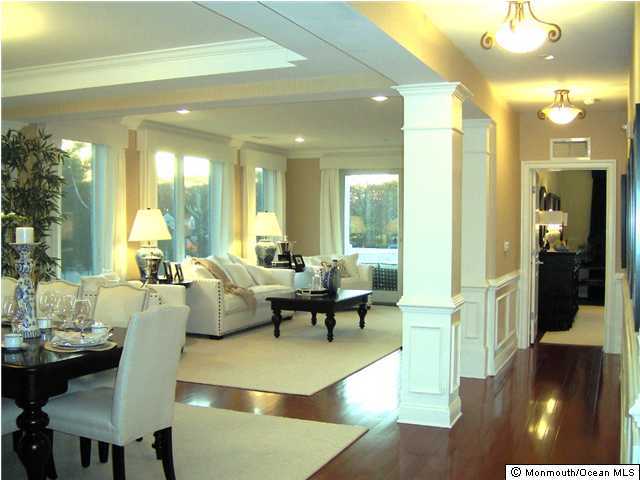 2201 River Road, Unit 3104 Point Pleasant, NJ 08742 - Photo 3 of 3 a living room with furniture and a chandelier