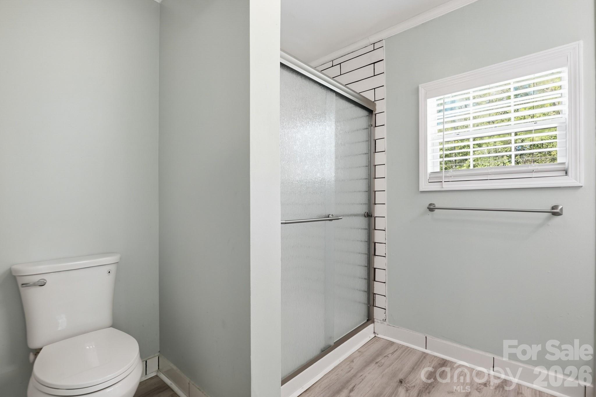 116 Springdale Drive York, SC 29745 - Photo 19 of 32 a white toilet sitting next to a window