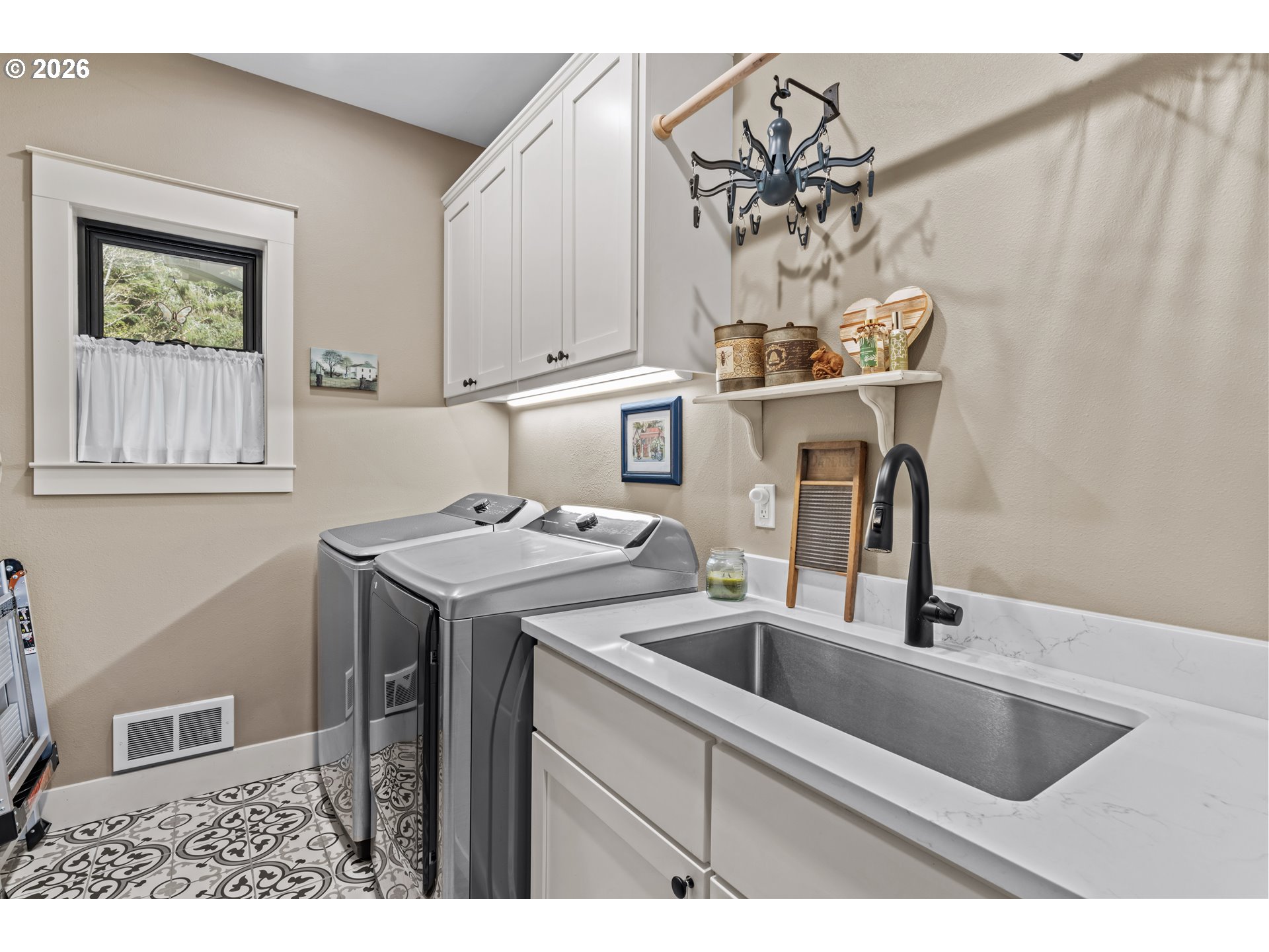 83489 Jensen Lane Florence, OR 97439 - Photo 21 of 48 a kitchen with a sink cabinets and window