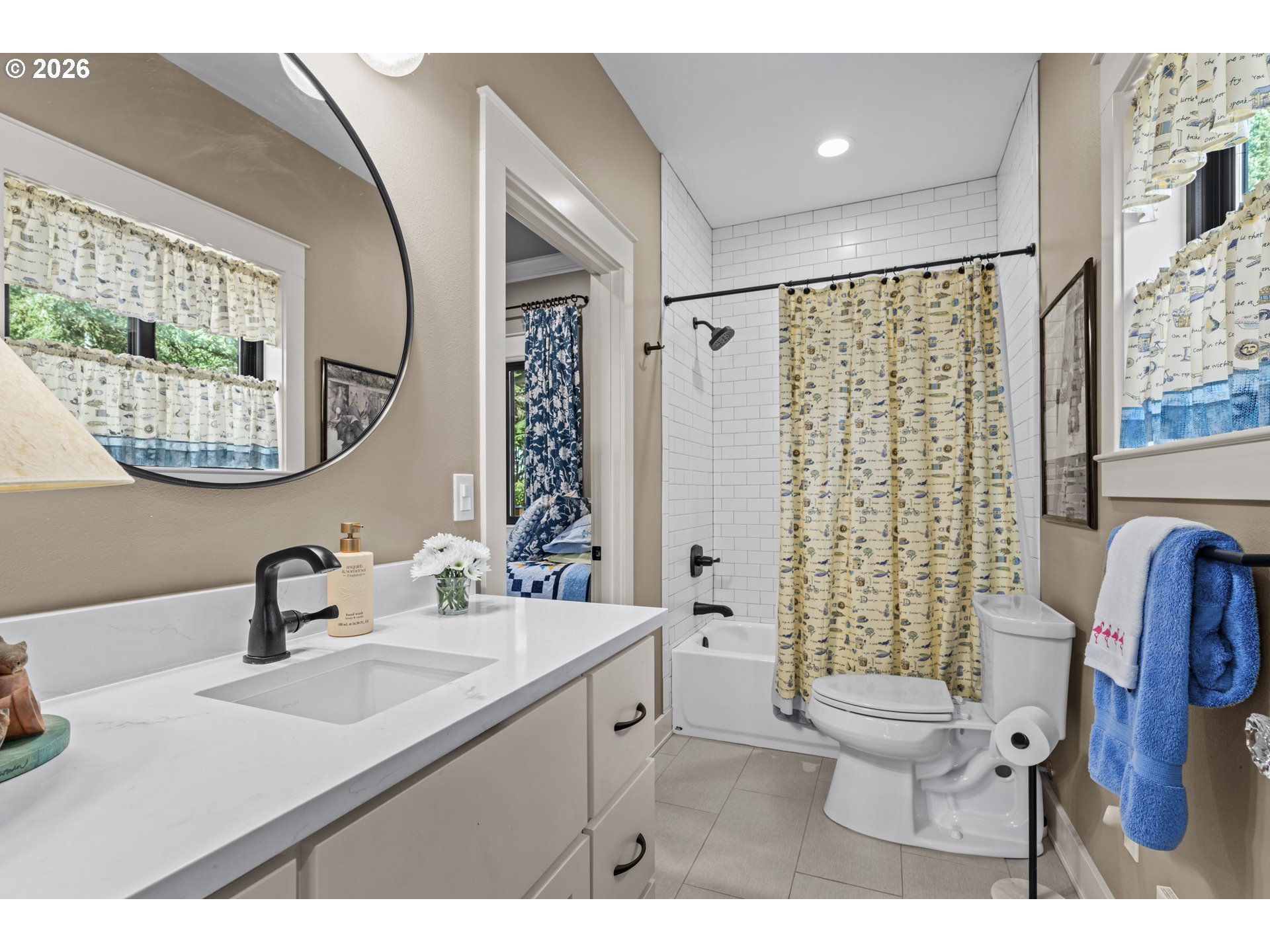 83489 Jensen Lane Florence, OR 97439 - Photo 24 of 48 a bathroom with a sink mirror a toilet and a shower