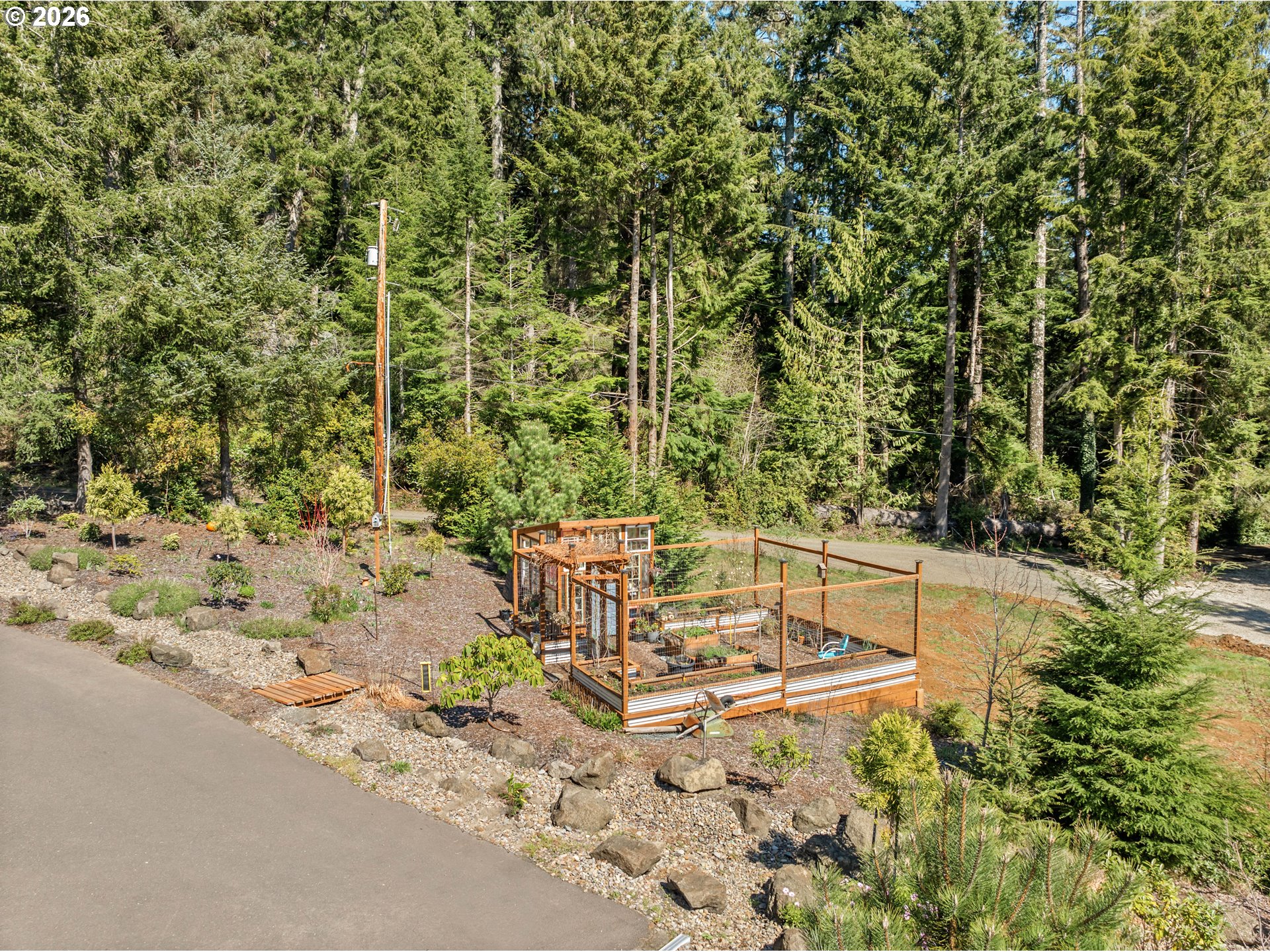 83489 Jensen Lane Florence, OR 97439 - Photo 39 of 48 a view of backyard with swimming pool and outdoor seating