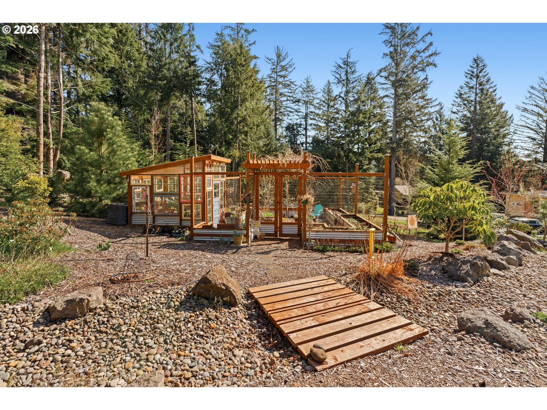 83489 Jensen Lane Florence, OR 97439 - Photo 40 of 48 a view of a backyard with sitting area