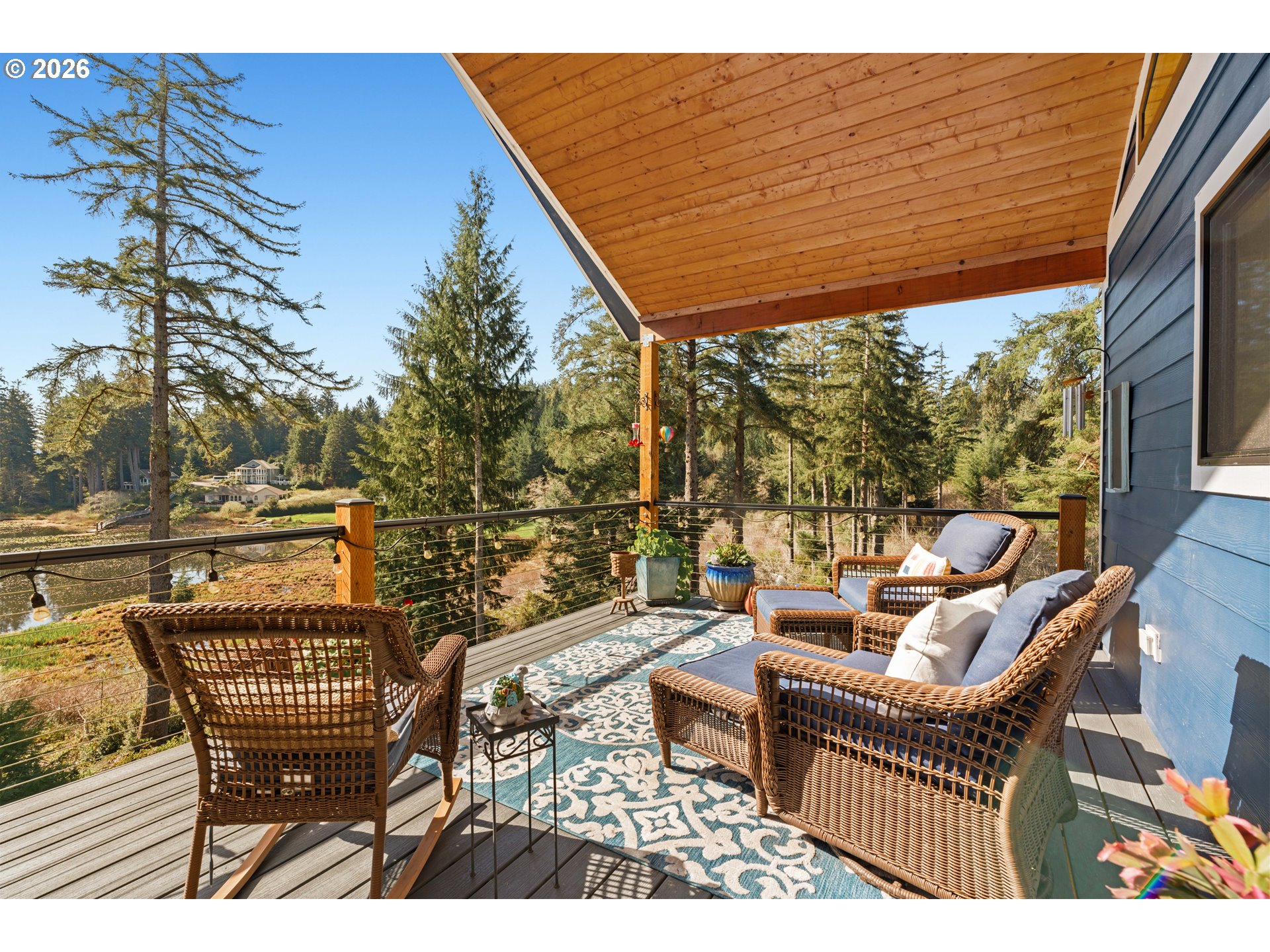 83489 Jensen Lane Florence, OR 97439 - Photo 9 of 48 a view of a patio with couches chairs and wooden floor
