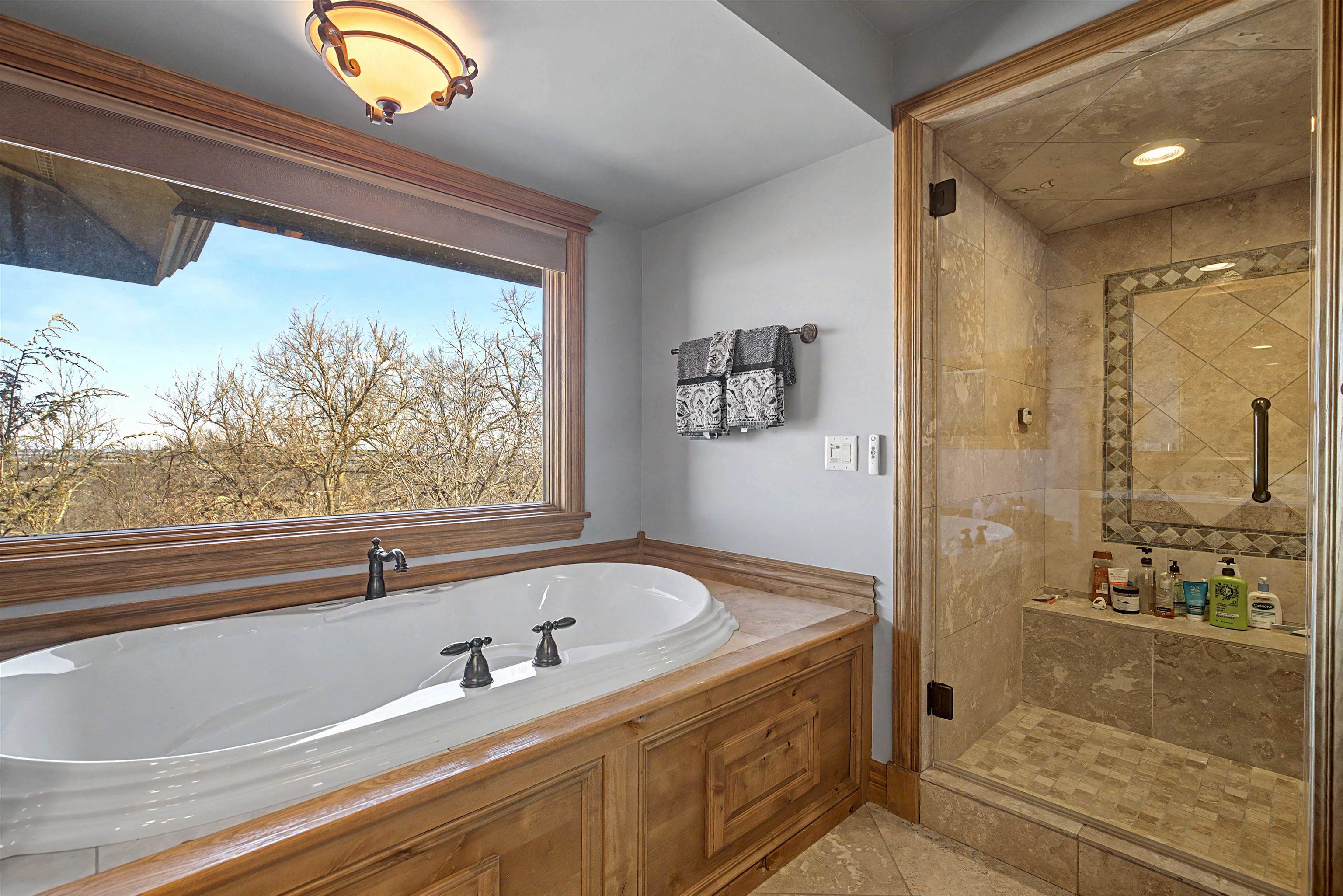 1 East Hoffman Road Elizabeth, IL 61028 - Photo 18 of 76 a bathroom with a bathtub and a shower