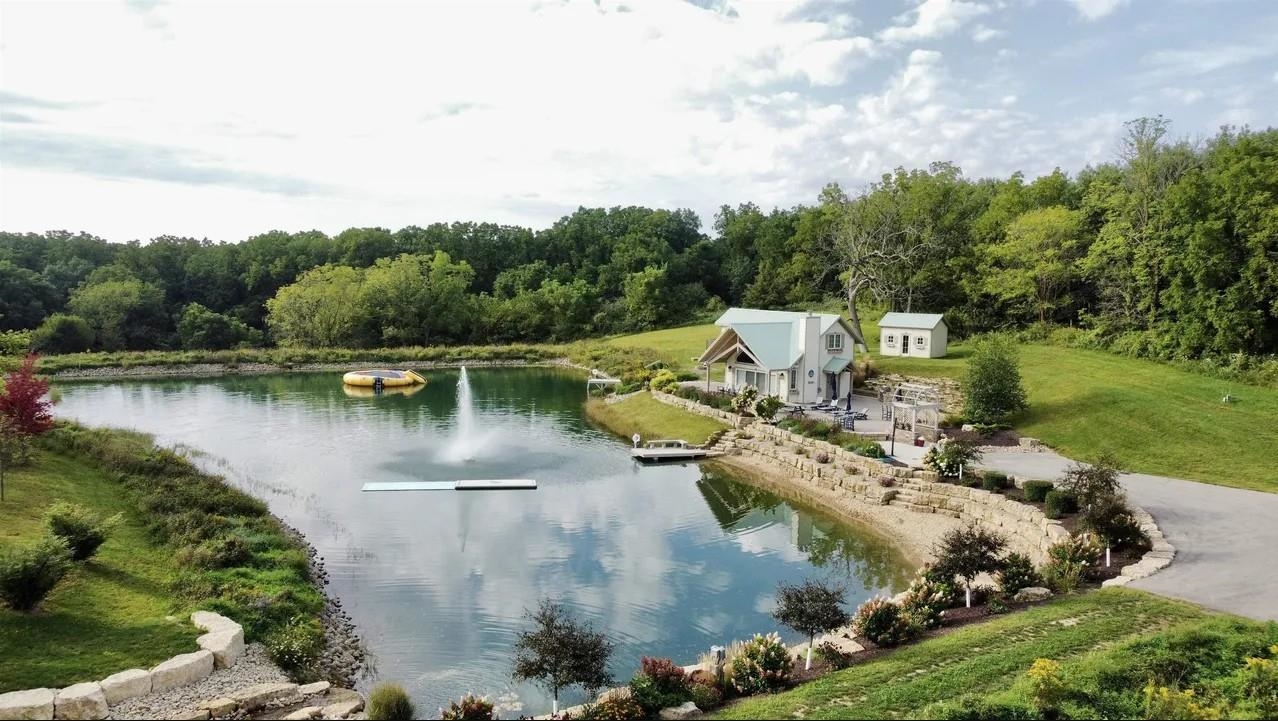 1 East Hoffman Road Elizabeth, IL 61028 - Photo 60 of 76 an aerial view of a house with a yard and lake view