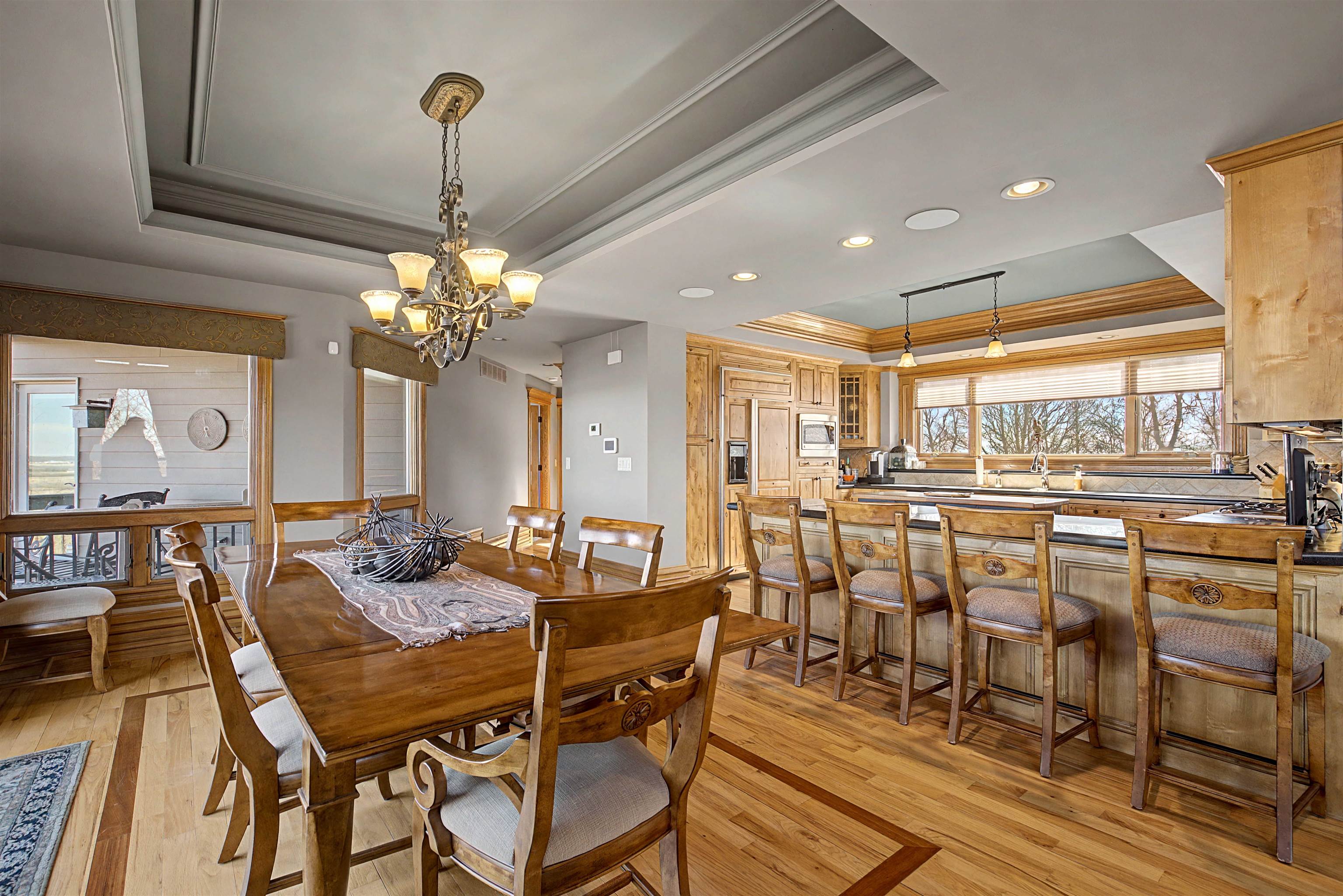 1 East Hoffman Road Elizabeth, IL 61028 - Photo 6 of 76 a view of a dining room with furniture a chandelier and wooden floor