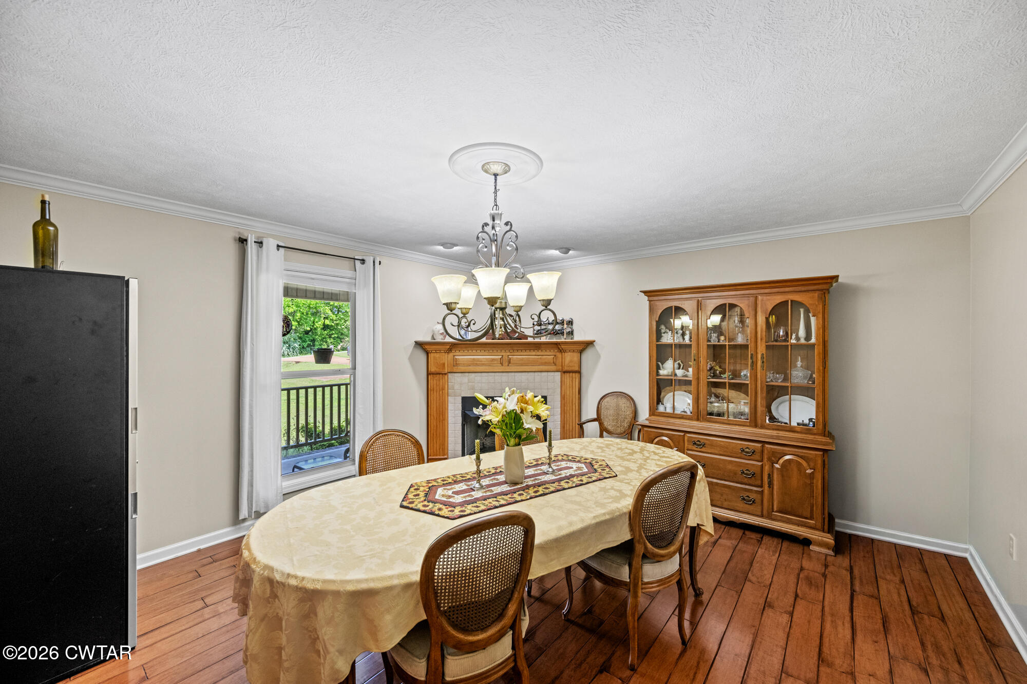492 Joe Horton Road Lexington, TN 38351 - Photo 16 of 49 a view of a dining room with furniture a chandelier and wooden floor