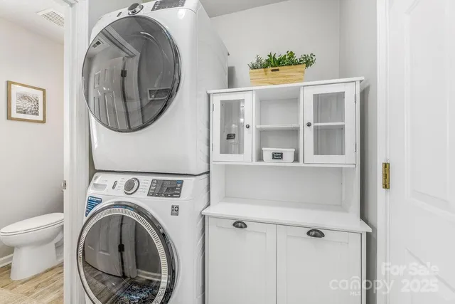 a view of bathroom with washer and dryer