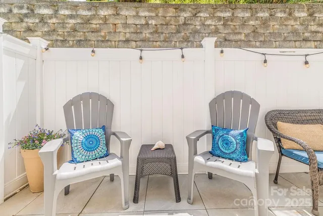 a view of a chairs and table in kitchen