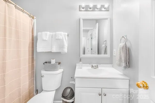 a bedroom with furniture and a potted plant