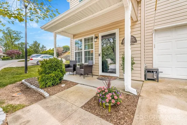 a building outdoor space with patio furniture and potted plants