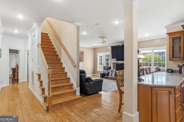 a bathroom with a sink double vanity granite tub and a mirror
