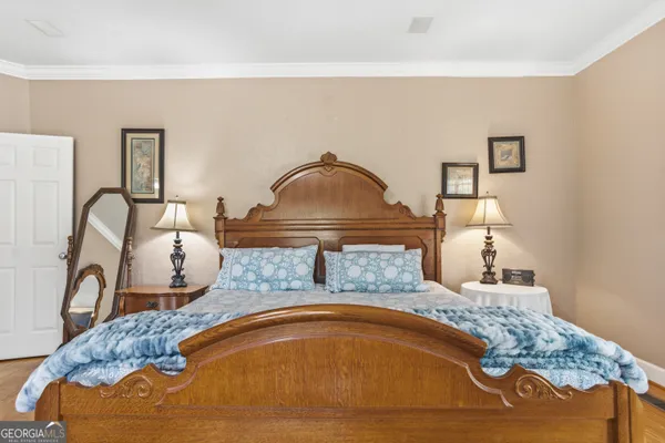 a view of a room with wooden floor and a window