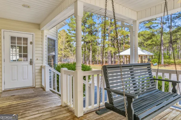 a view of a balcony with wooden floor