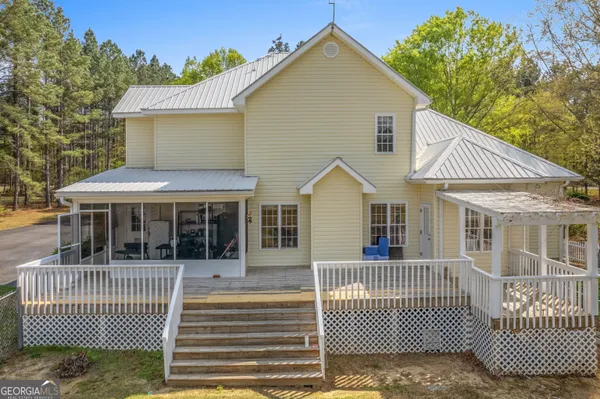 a view of a swimming pool with a lawn chairs