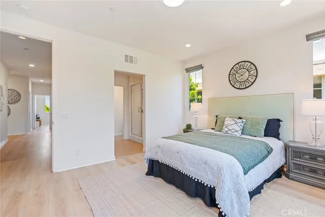 a bedroom with a bed and a table