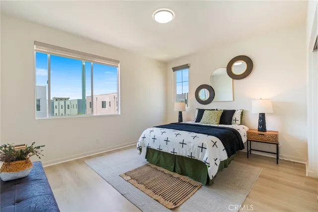 a bedroom with a bed and window