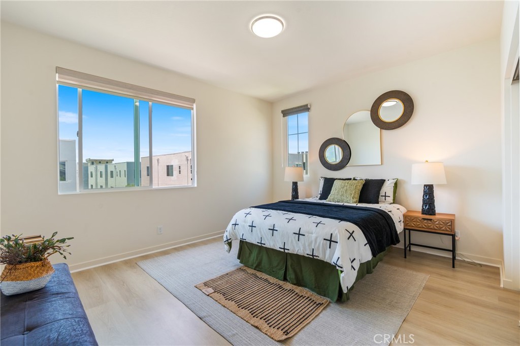747 Beacon Irvine, CA 92618 - Photo 20 of 28 a bedroom with a bed and window