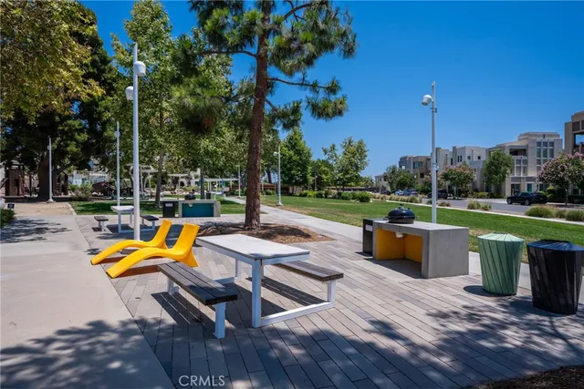 a view of a swimming pool with lounge chairs in patio