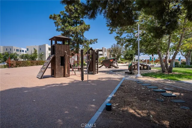 a childrens park with lots of swings and slides